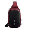 Small dark blue waterproof oxford cloth chest bag showing front zipper closure and strap