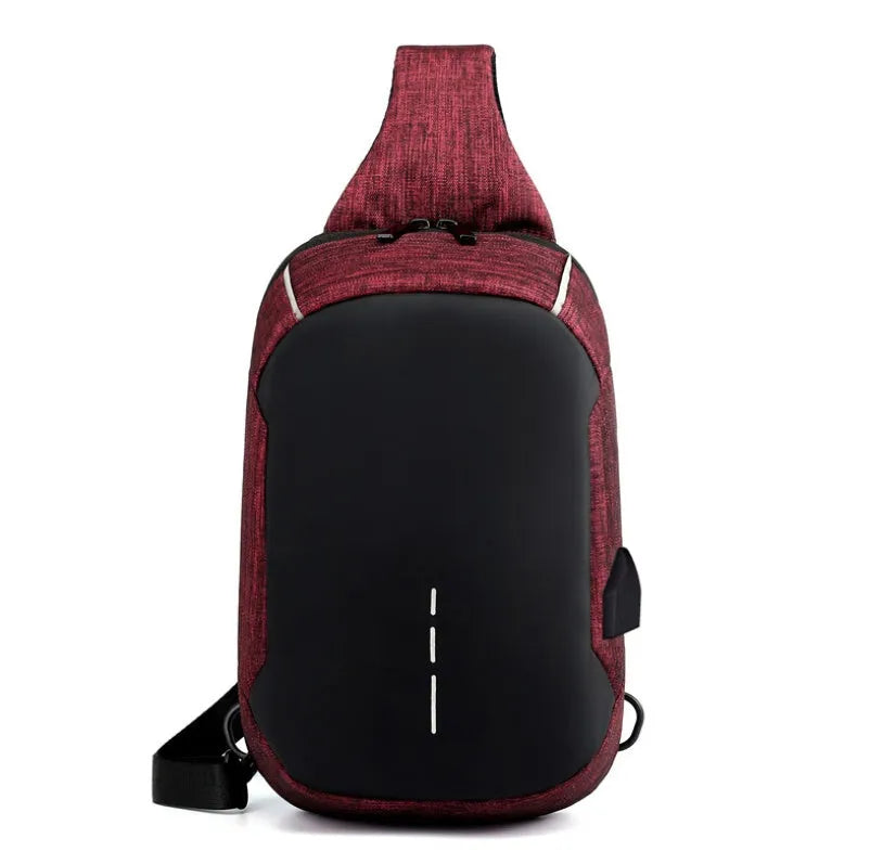 Small dark blue waterproof oxford cloth chest bag showing front zipper closure and strap