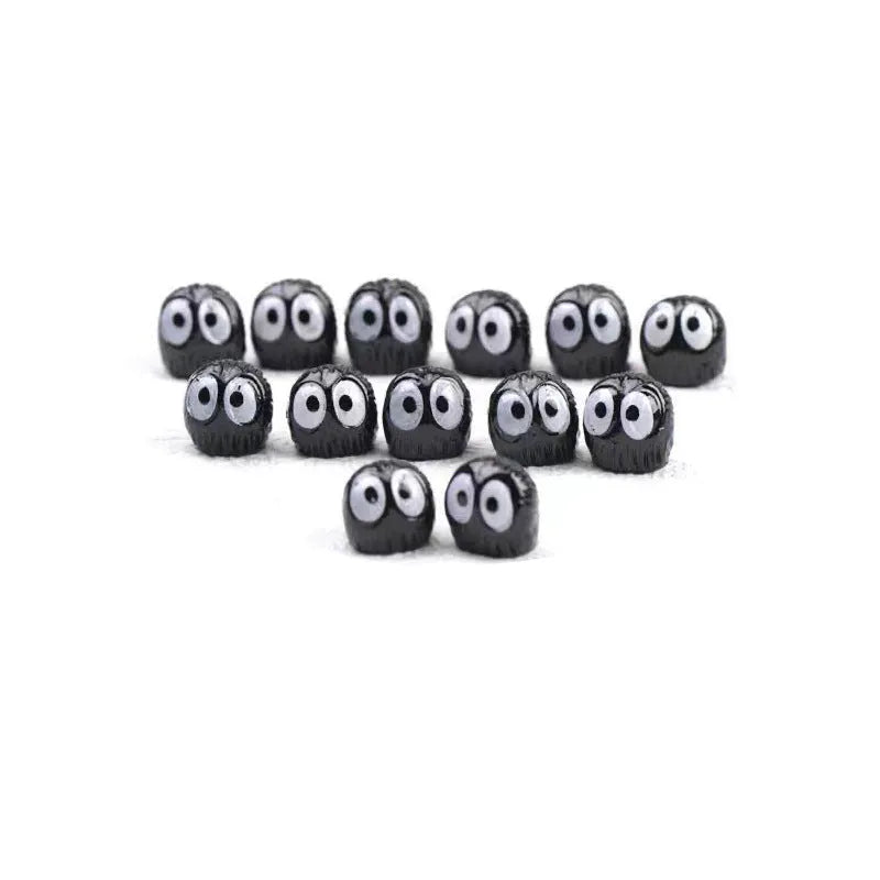 Black resin cartoon briquette car ornament with small coal pieces for dashboard decoration