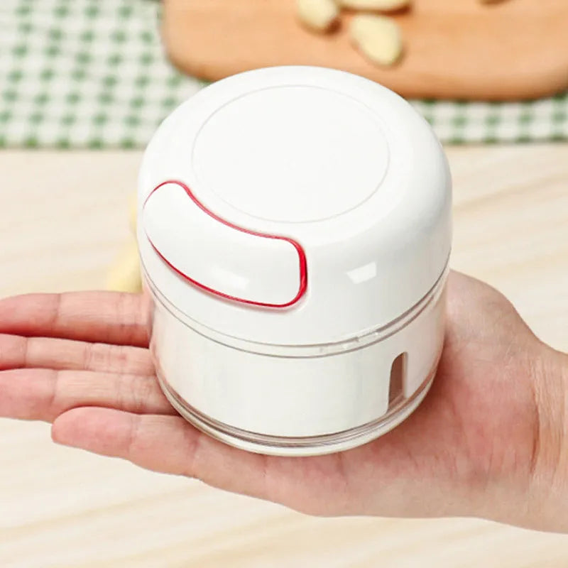 Manual cutting meat grinder with white plastic body and 304 stainless steel blade, compact size 8.5x7 cm