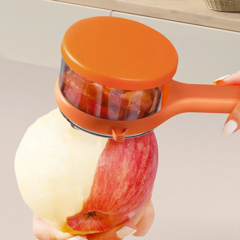 Kitchen multi-functional peeler with bucket storage in light green plastic on a clean countertop