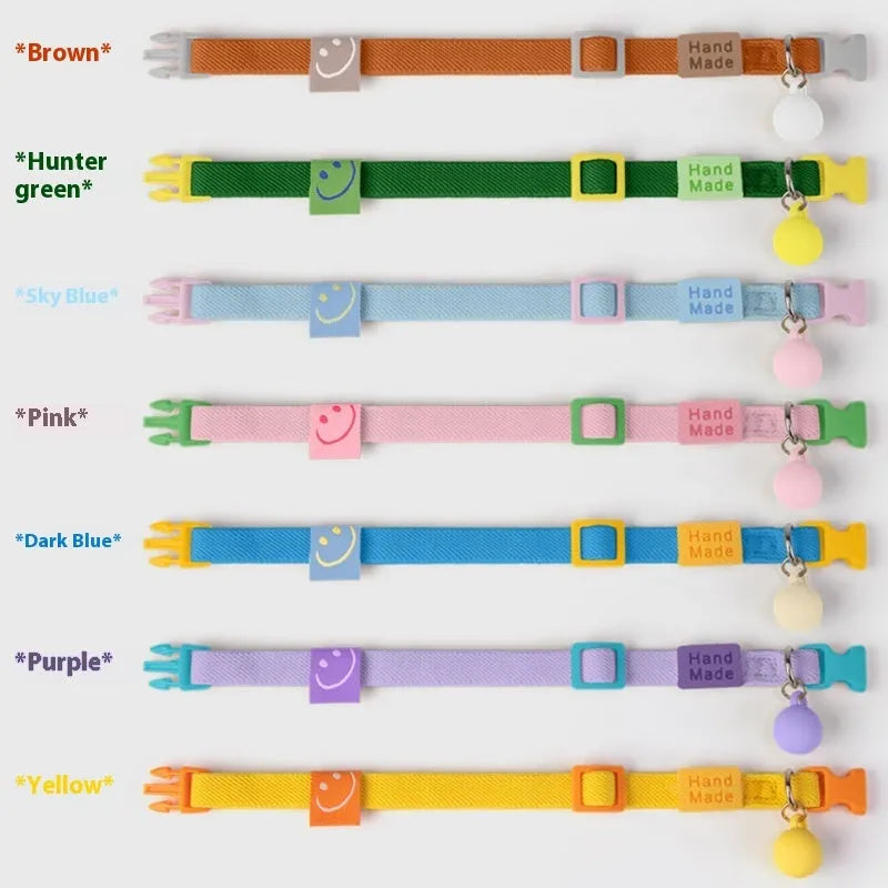 Elastic polyester decorative dog collar for small breeds, adjustable from 22cm to 32cm, shown in a monochrome colour.