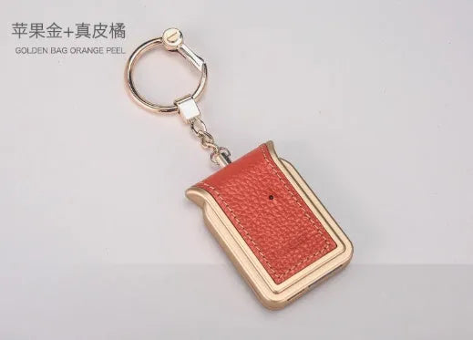 Bluetooth dual SIM adapter keychain with Nano SIM slot and leather finish, compatible with iOS devices