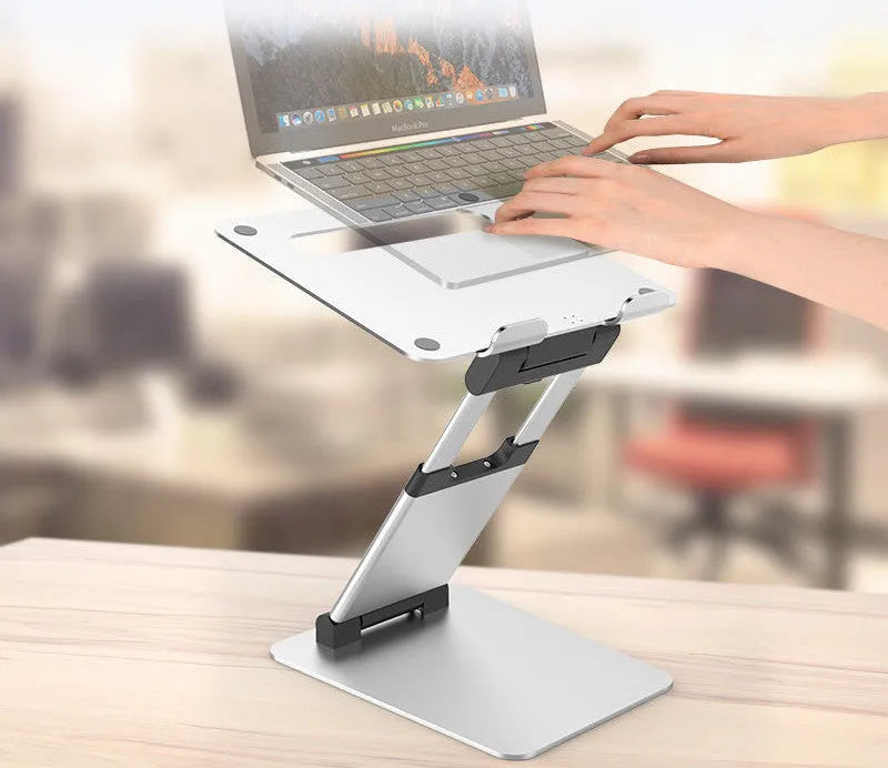 Silver aluminium alloy folding double-arm stepless stand holding a 17-inch notebook on a desk