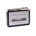 Cassette to MP3 converter device with USB cable on a desk next to a cassette tape