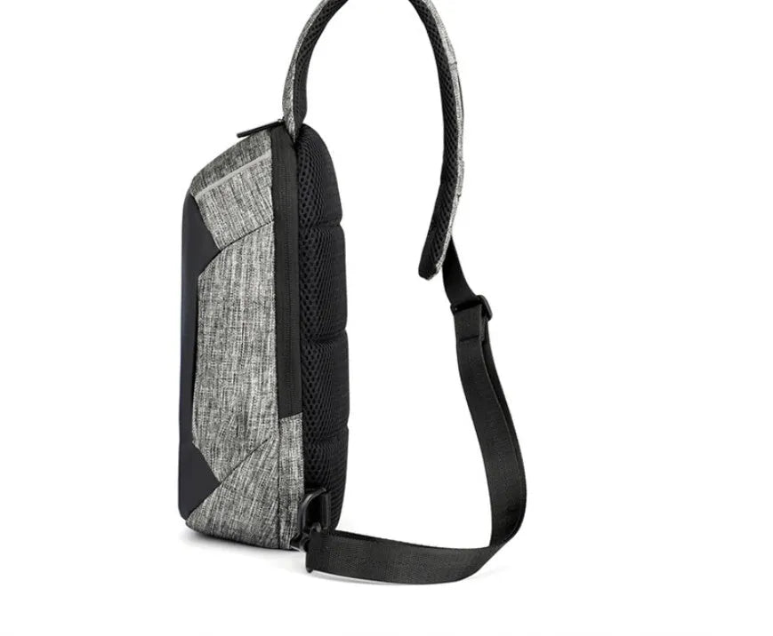Small dark blue waterproof oxford cloth chest bag showing front zipper closure and strap