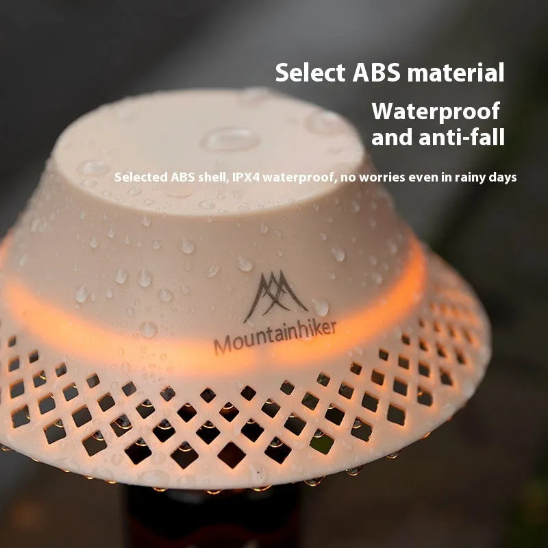 Beige and grey wine bottle shaped camping lantern with USB-C port showing three light mode options