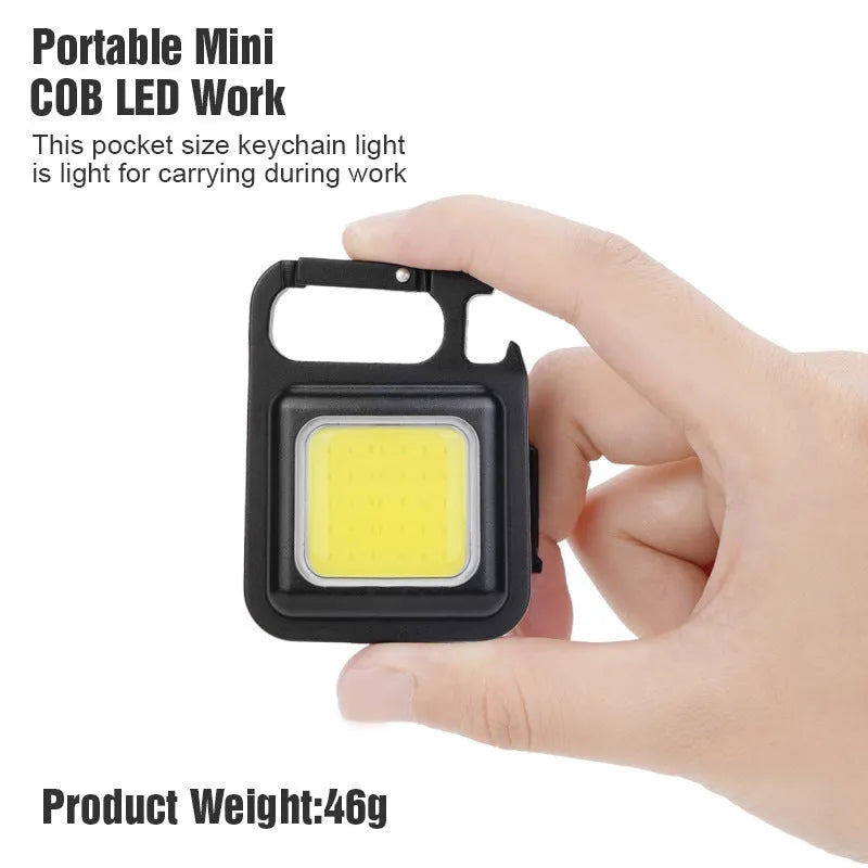 Black aluminium alloy COB keychain light with magnetic base, foldable handle, and key ring, 6x4.2cm