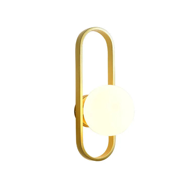 Minimalist modern wall lamp with iron body and glass shade in black or gold finish.