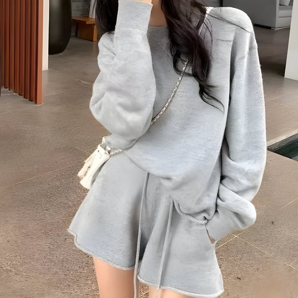 Women's loose-fitting long sleeve sweater and knitted wide-leg shorts co-ord set in dark grey.