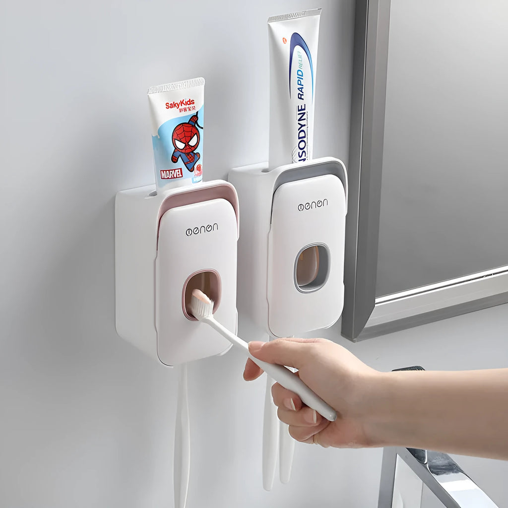 Automatic toothpaste dispenser in blue, grey, and pink colours made from ABS plastic.