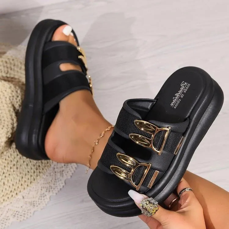 Women's apricot suede slippers with a thick rubber sole on a white background.