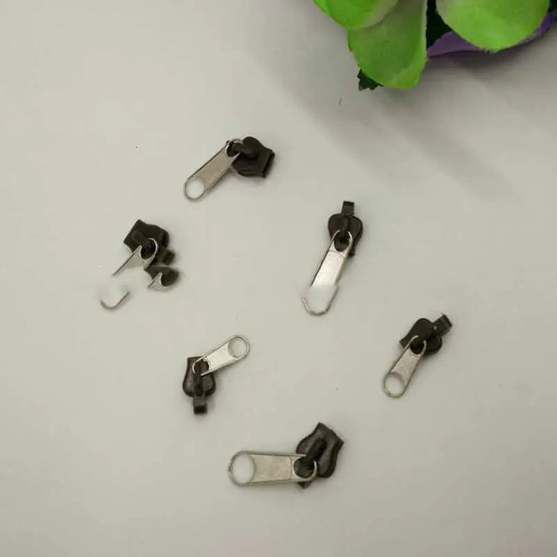 Plastic and metal zipper head replacement kit in brown, black and half black colour options, snap-on design