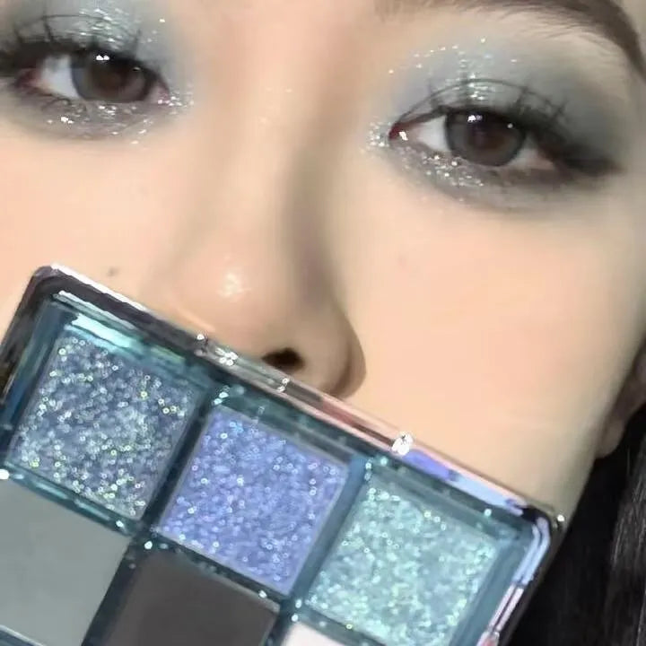 MUGELEEN nine-colour eye shadow palette showing blue smokey shades with matte and shimmer finishes