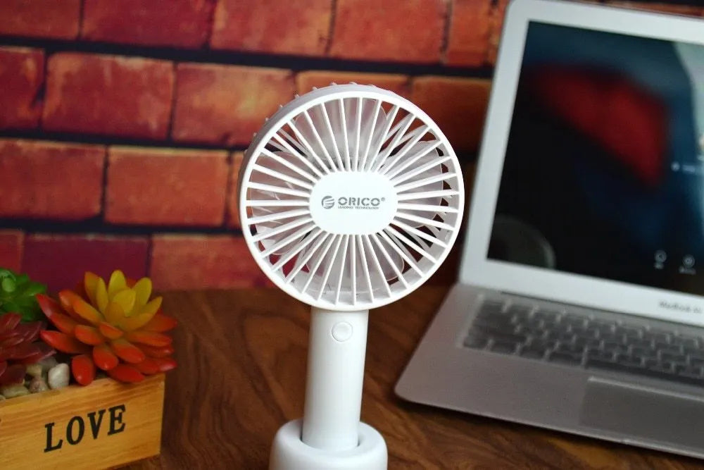 ORICO FH1 white portable USB desk fan with rechargeable battery shown on a desk