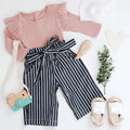 Women's pink cotton long sleeve top with size chart showing bust, length, waist measurements in centimetres