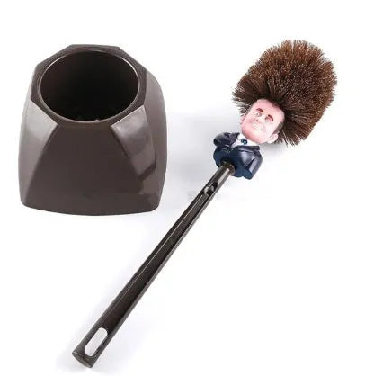 Yellow plastic Donald Trump toilet brush with handle slot, 40cm length, on white background