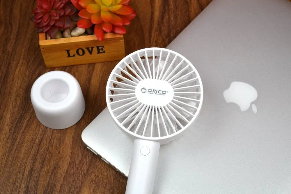 ORICO FH1 white portable USB desk fan with rechargeable battery shown on a desk