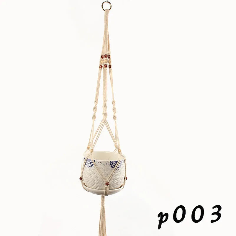 Woven cotton rope plant hanger in a hanging configuration holding a potted plant.