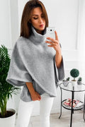 Women's longline batwing sleeve cardigan in a faux two-piece style with stitching detail.