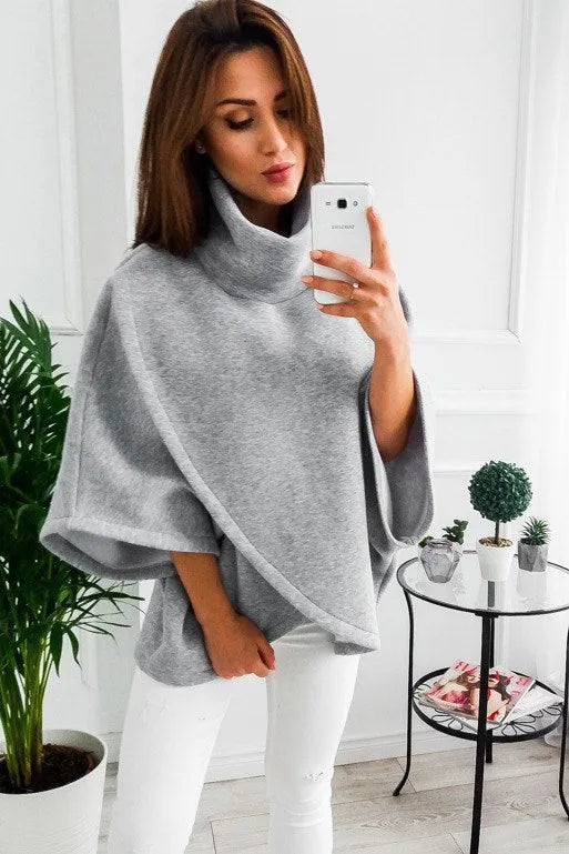 Women's longline batwing sleeve cardigan in a faux two-piece style with stitching detail.