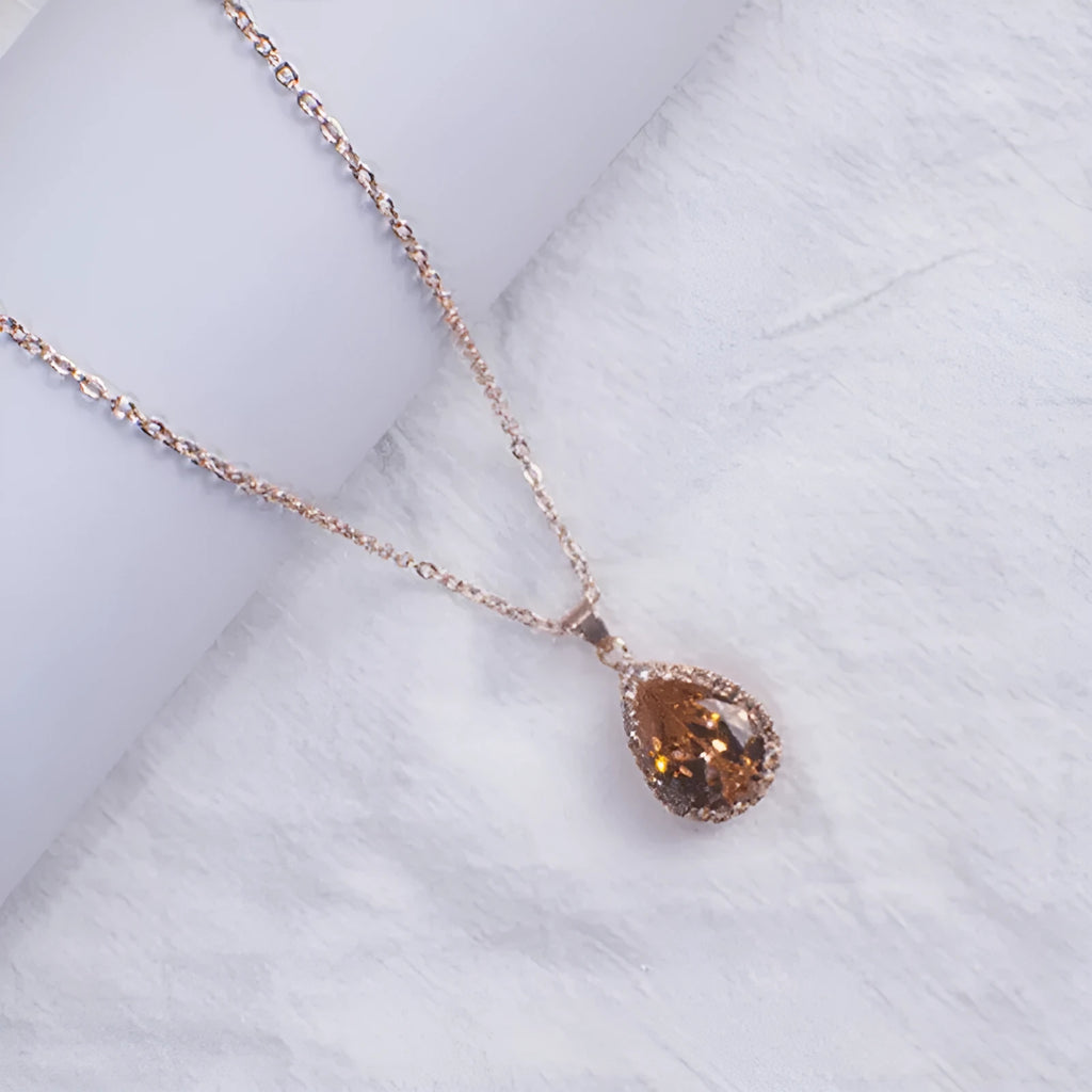 Drop-shape alloy necklace with rhinestone inlay available in eight electroplated colour finishes