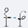 Black aluminium alloy floor stand holding a mobile phone with built-in fill light switched on