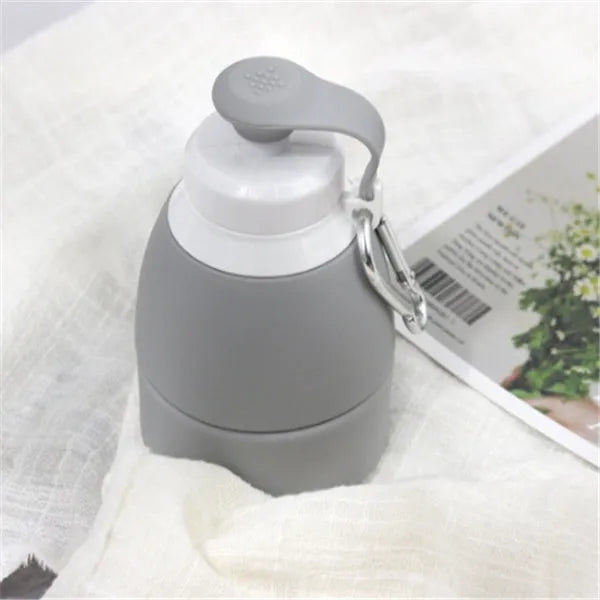 Silicone folding water bottle 580ml in grey, collapsed and full size, food grade portable sport bottle