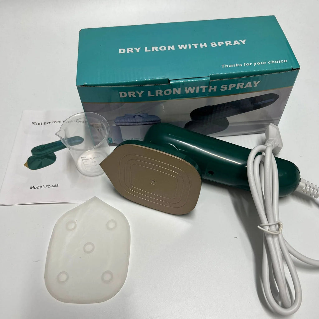 Handheld portable garment ironing machine in dark green with large titanium panel, UK plug