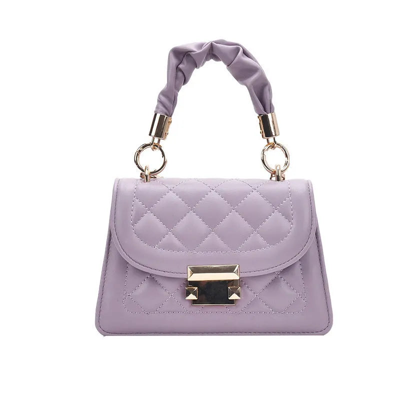 Purple women's small square shoulder bag with crossbody strap showing tapered 16x19cm design