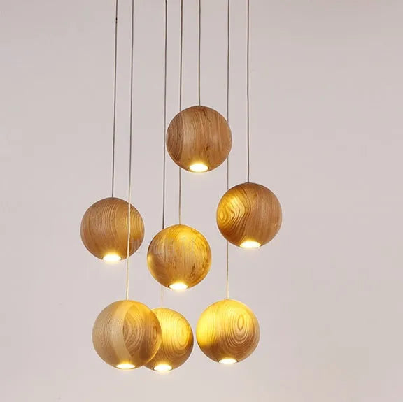 Nordic solid wood ball pendant chandelier with adjustable cord, shown in single and three-head style options.