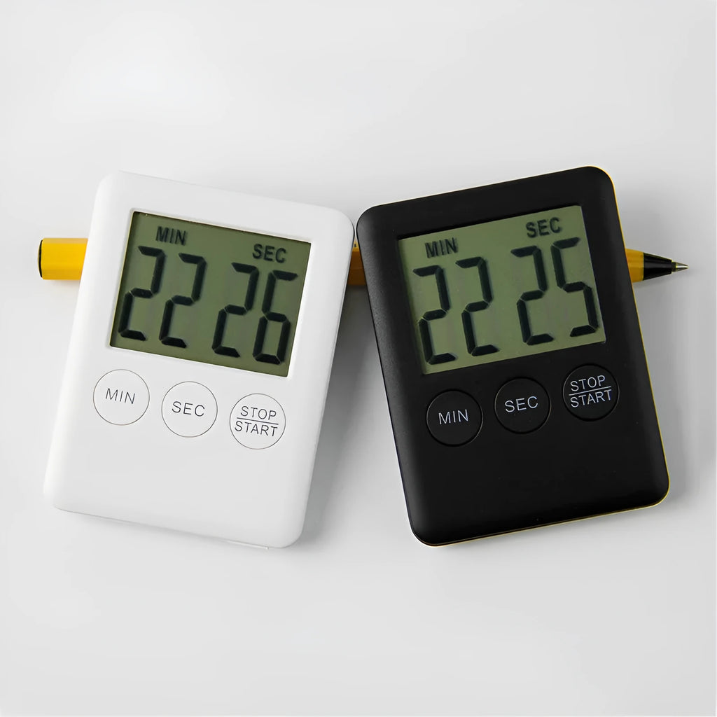 Black and white digital kitchen timer with magnetic back showing countdown display