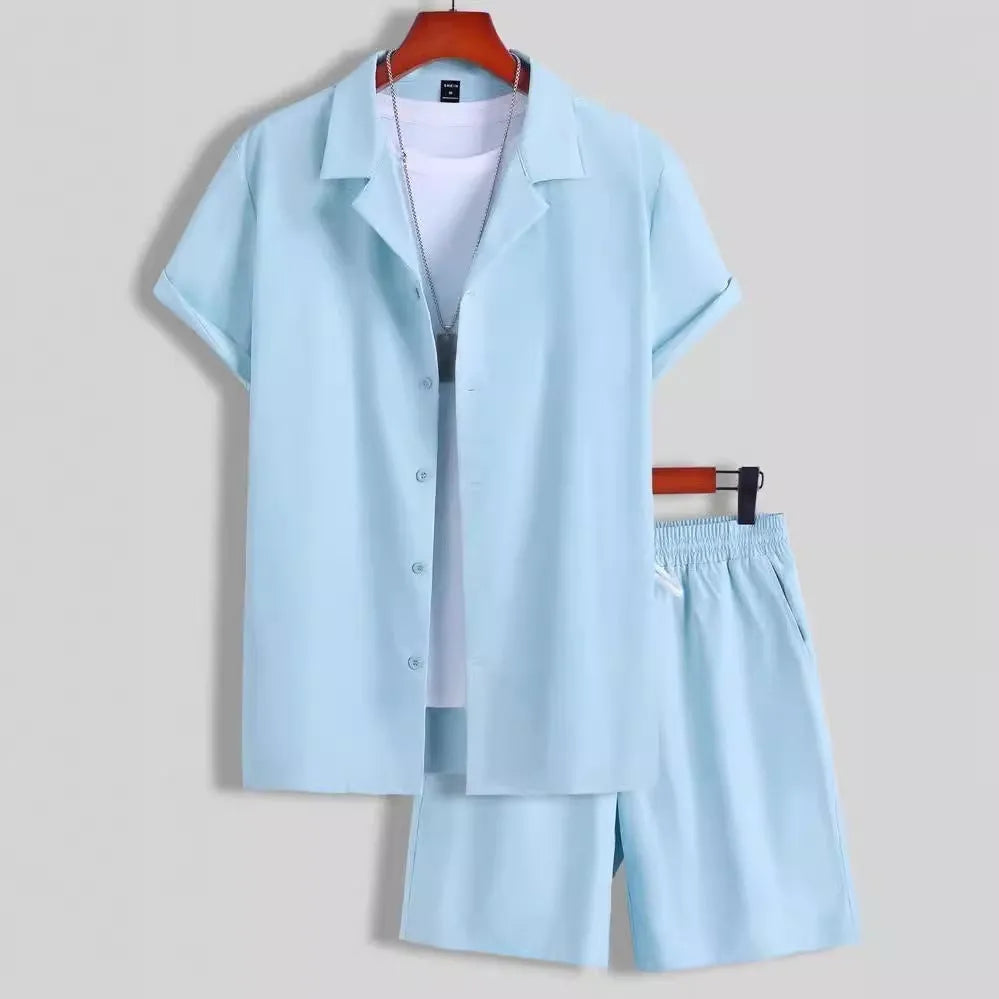 Man wearing a light blue short sleeve Cuban collar shirt and matching sport shorts.