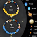 Two natural stone beaded bracelets with zodiac sign designs and adjustable sliding knots on a wrist.