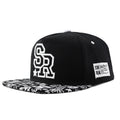 Cotton baseball cap with embroidered letters in black colour showing adjustable strap and dome crown