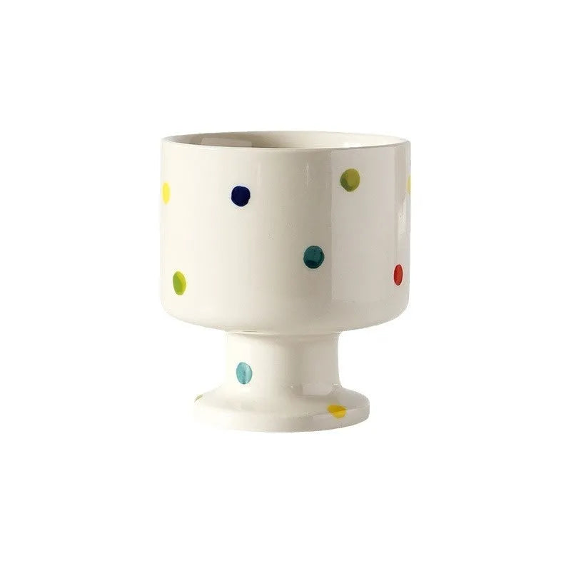 Hand-pinched irregular ceramic mug in solid colour with modern simplicity design