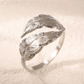 Women's adjustable feather ring in titanium steel with gold electroplated finish featuring number element