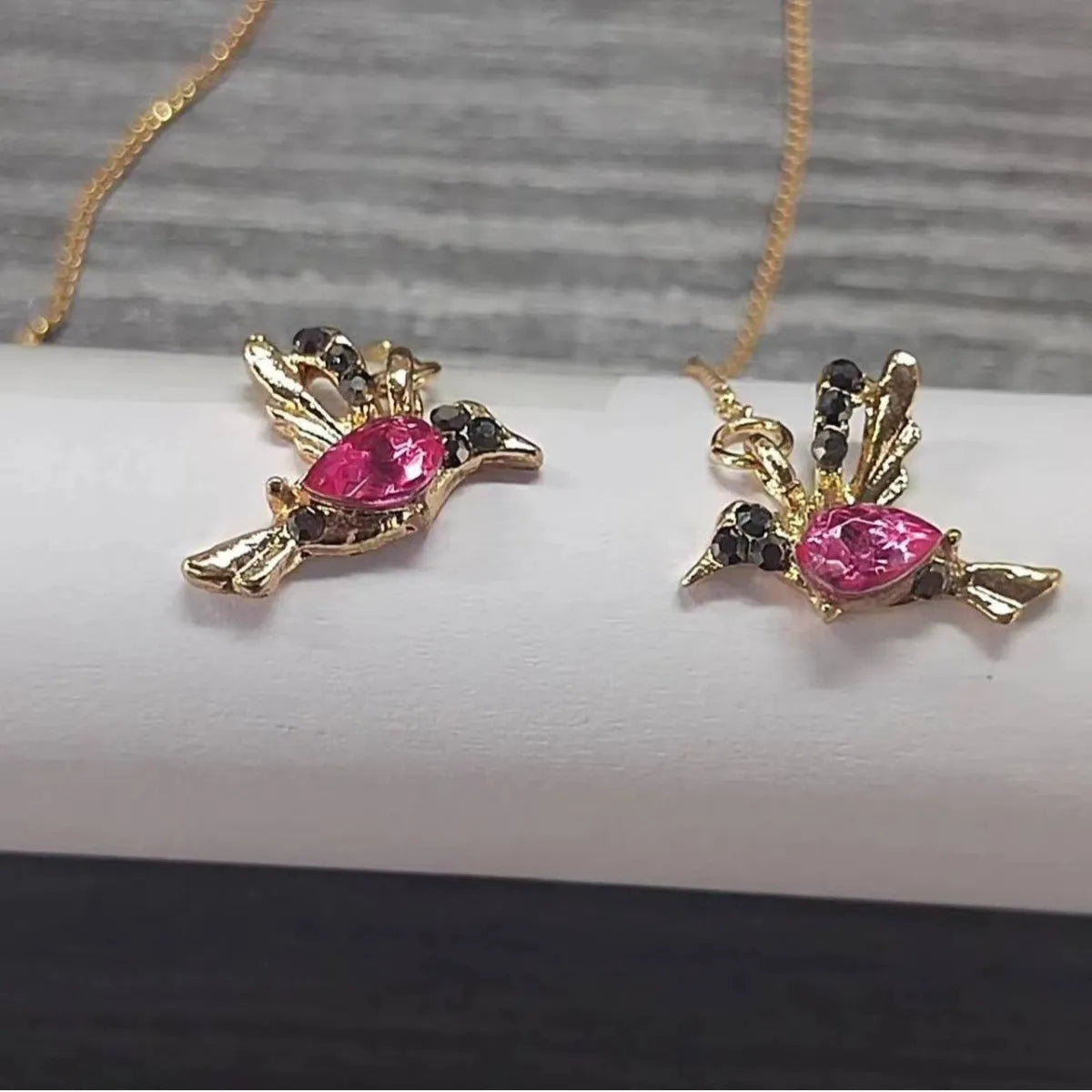 Women's long hanging earrings with bird charm design featuring zirconium wings in blue, red, and red lvzuan colour options