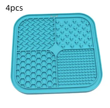 Green silicone pet licking pad 20x20cm with suction cup base on a tiled floor
