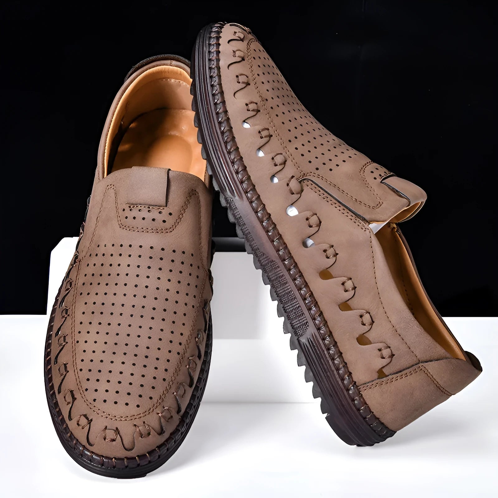 Men's brown slip-on casual shoes with artificial PU upper and flat PVC sole, showing sewing line details
