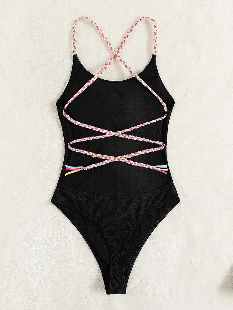 Solid black backless one-piece nylon swimsuit for women with tight fit and high-cut leg