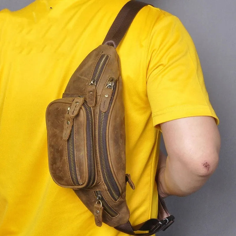 Brown leather shoulder messenger bag with single strap and large main compartment.