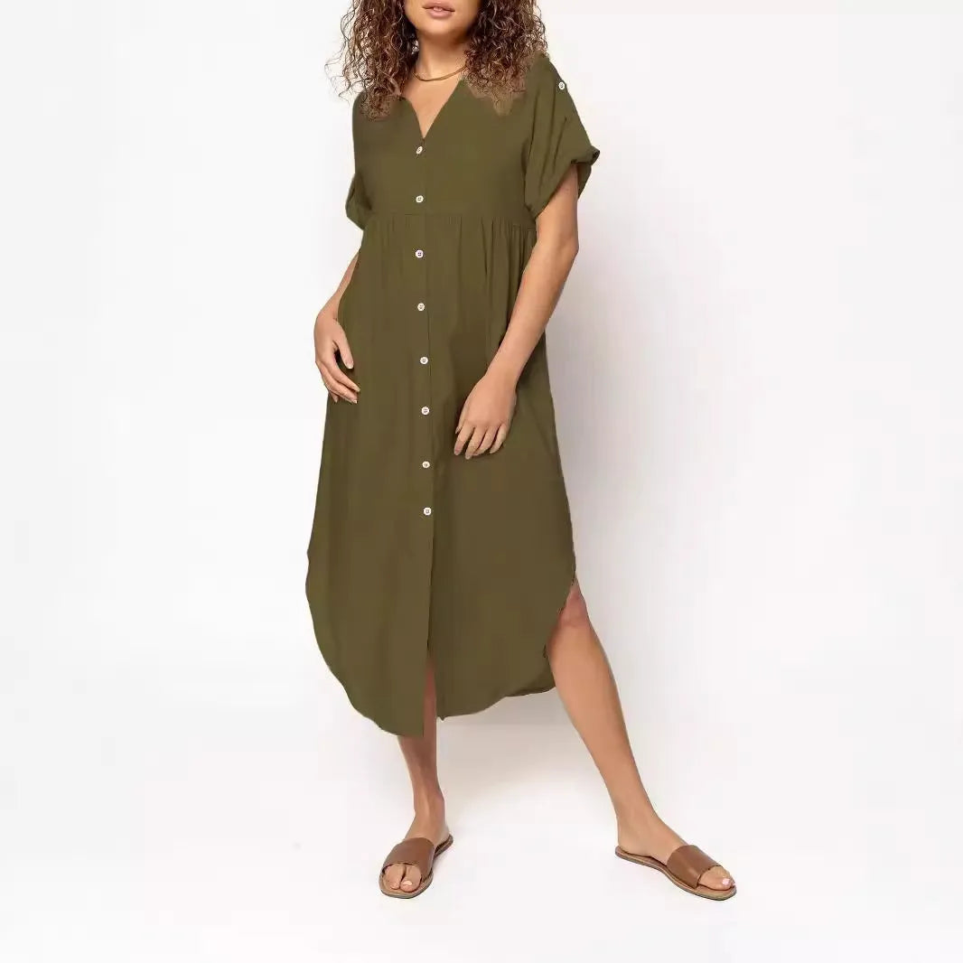 A loose-fitting, solid-colour button-down midi dress on a hanger, shown in apricot colour.