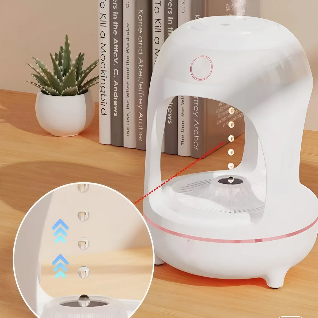 Anti gravity levitating water drops ultrasonic humidifier with LED night light in rose gold and white on a desk