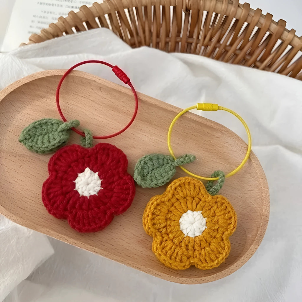 Pure hand crochet finished knitting wool plush small red flower pendant on white background