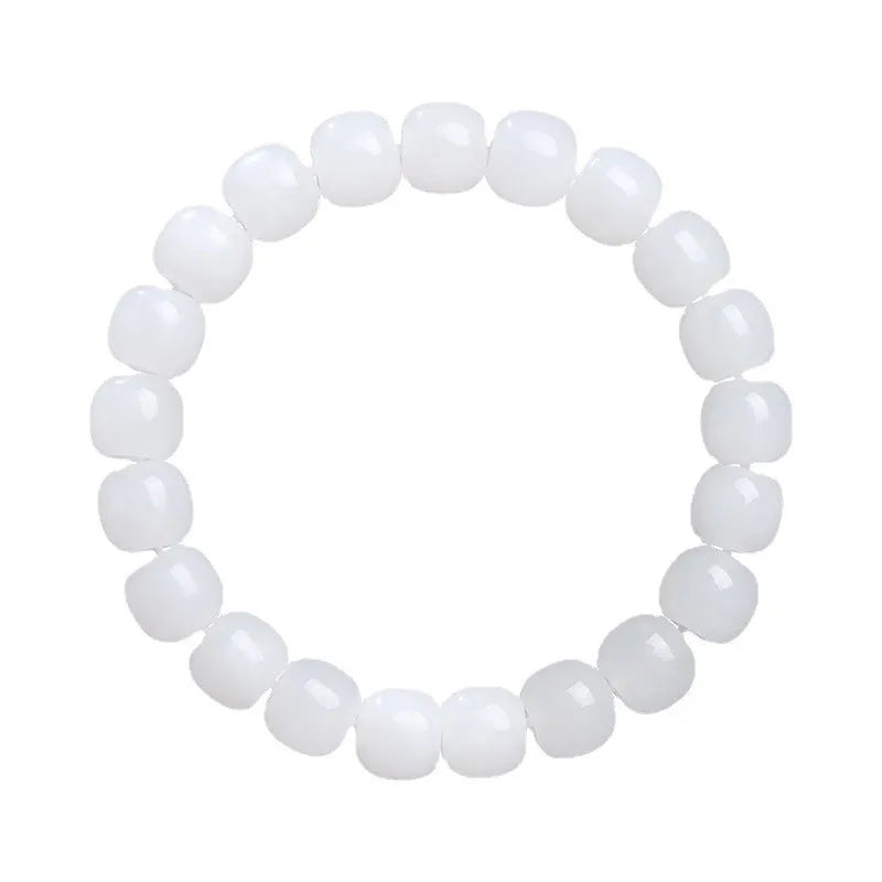 White Hetian jade barrel bead bracelet on a wrist, showing three bead size options for men and women.