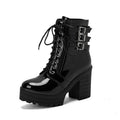 Women's black thick-heeled short boots with lace-up front and round toe, showing waterproof platform detail