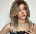 Mid-length curly synthetic wig with platinum gradient colours and bangs