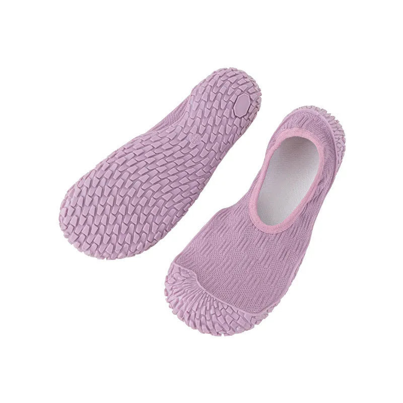 Women's indoor fitness shoe in solid colour with soft bottom, mesh upper, and rubber sole