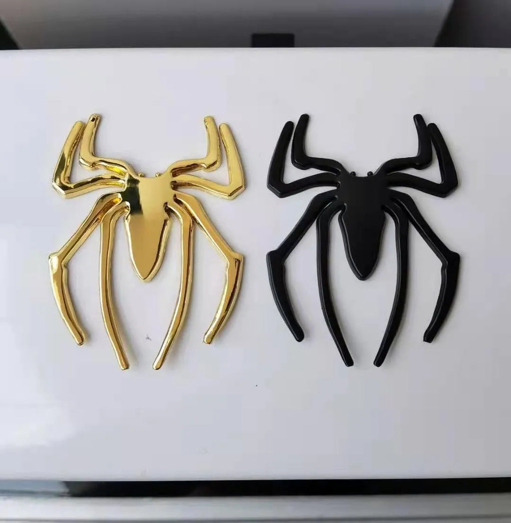 Zinc alloy 3D spider bumper sticker in metallic colours on a car bumper.